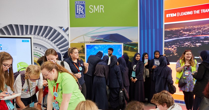 Young people taking part in a Rolls-Royce stand STEM activity