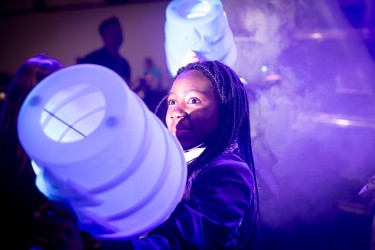 A young person interacts with exhibits and stands and activities at The Big Bang Fair