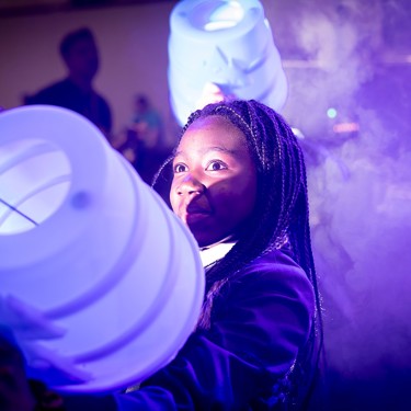 A young person interacts with exhibits and stands and activities at The Big Bang Fair