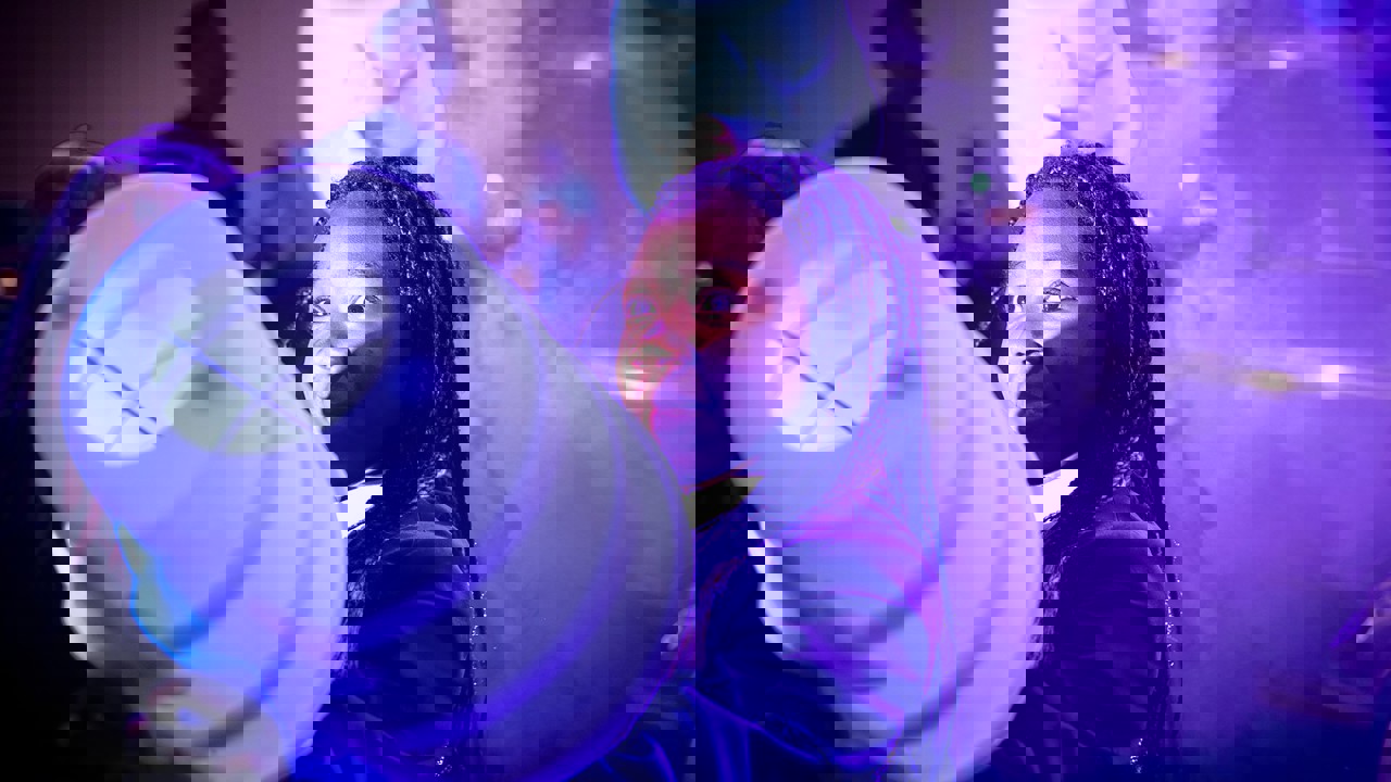 A young person interacts with exhibits and stands and activities at The Big Bang Fair