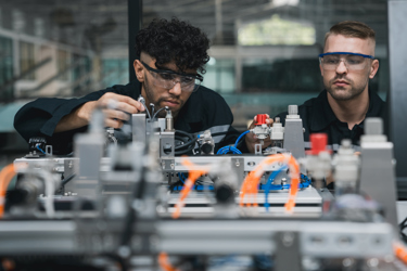 Two engineers working with equipment and machinery