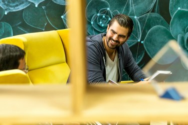 Business professional smiling and talking in a meeting