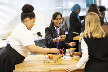 Girls working in a team doing an Energy Quest experiment