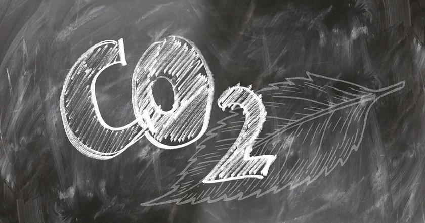 the chemical formula for carbon dioxide written in chalk on a blackboard