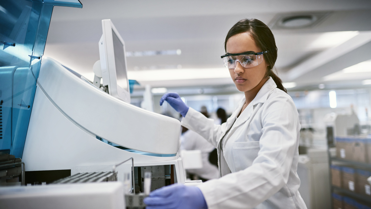 A scientist in a lab, working 