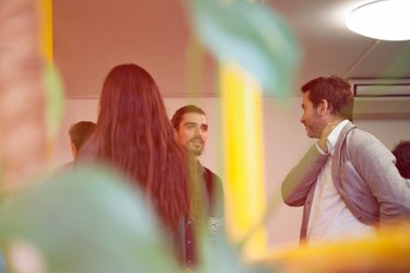 A group of people at an event talking