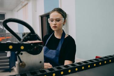 An engineer works with machinery 