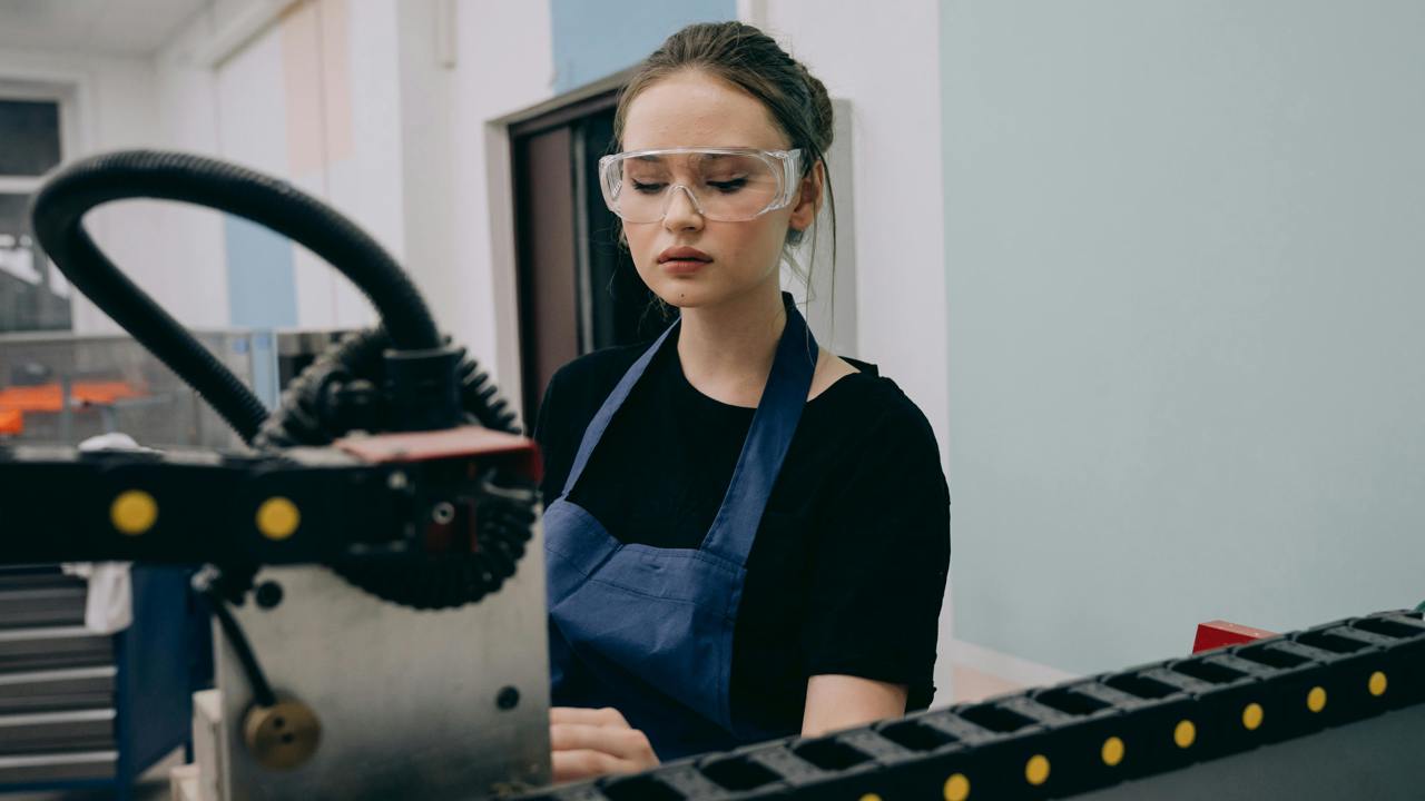 An engineer works with machinery 