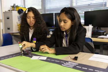 Young people in school working on an experiment 