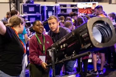 A young person interacts with exhibits and stands and activities at The Big Bang Fair