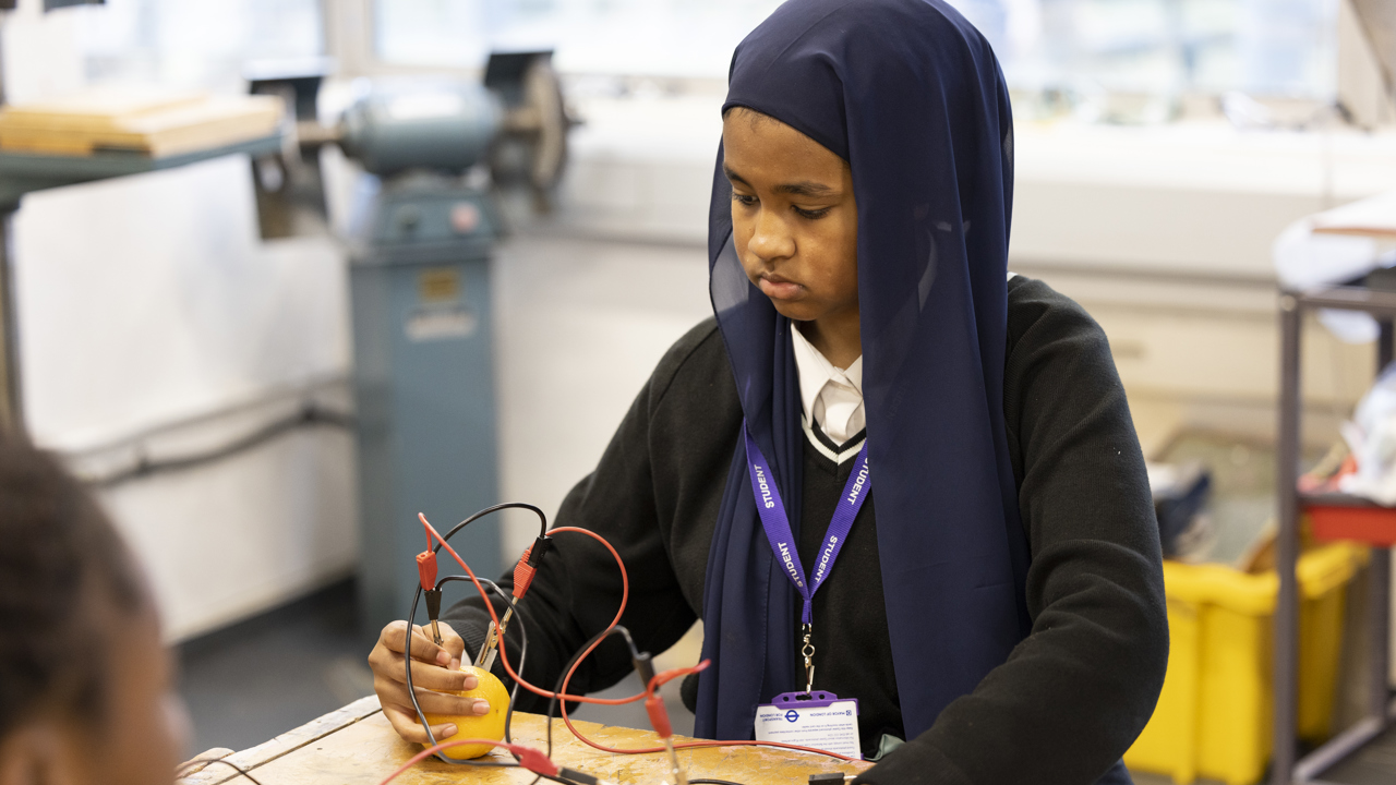 Girl doing an Energy Quest experiment