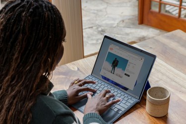 Women typing on a laptop