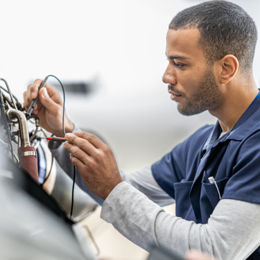 Two engineers work with cables