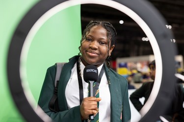 A young person interacts with exhibits and stands and activities at The Big Bang Fair