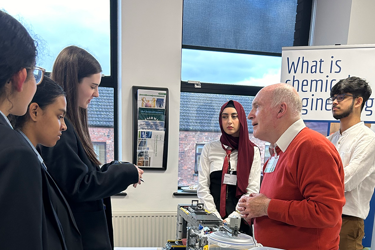 Young people in a classroom learning about chemical engineering