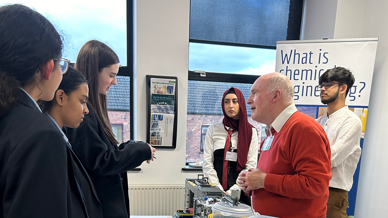 Young people in a classroom learning about chemical engineering