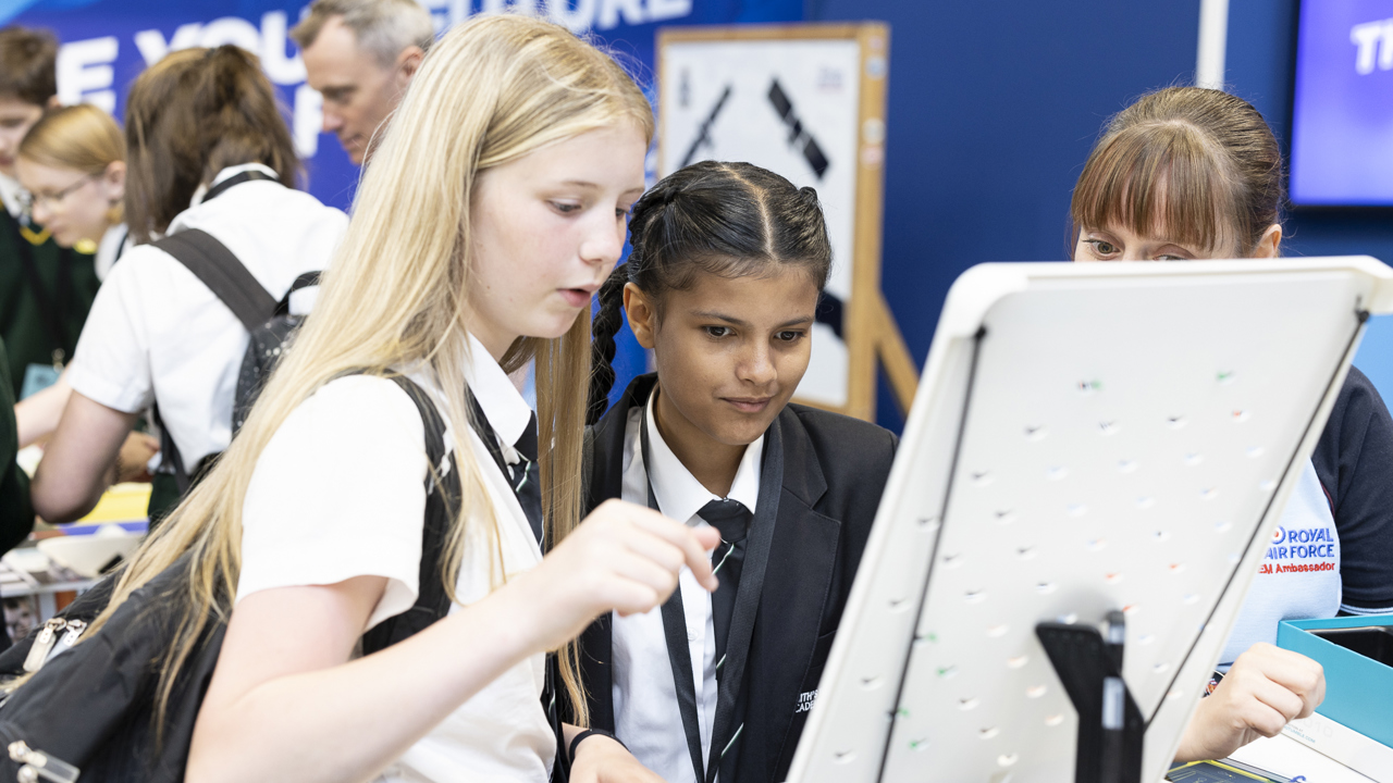 Two young people look at an exhibit