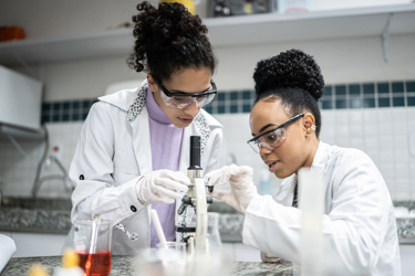 Scientists in a lab surrounded by equipment