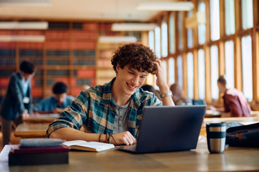 Student on laptop in library