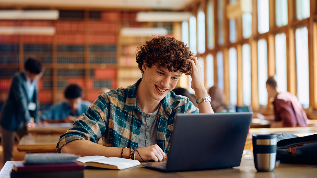 Student on laptop in library